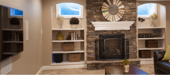 Modern living room with brick fireplace and white built-in shelving units
