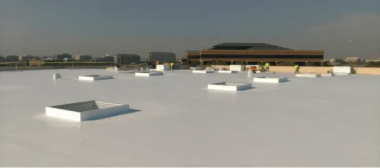 White commercial rooftop with HVAC units and industrial buildings in background