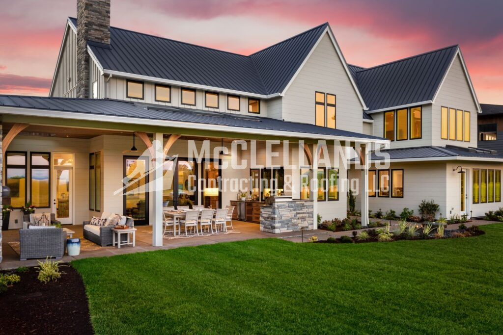 Beige siding with black metal roof