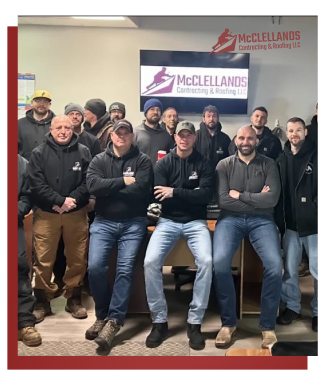Team of construction workers posing together at McClelland Contracting office