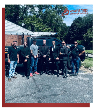 Group of seven men posing together outdoors in front of work truck