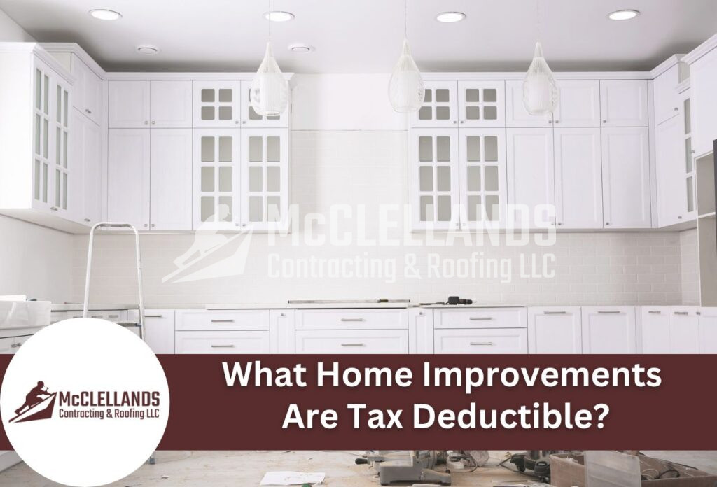 Modern White Kitchen Renovation With Glass-Front Cabinets And Pendant Lighting