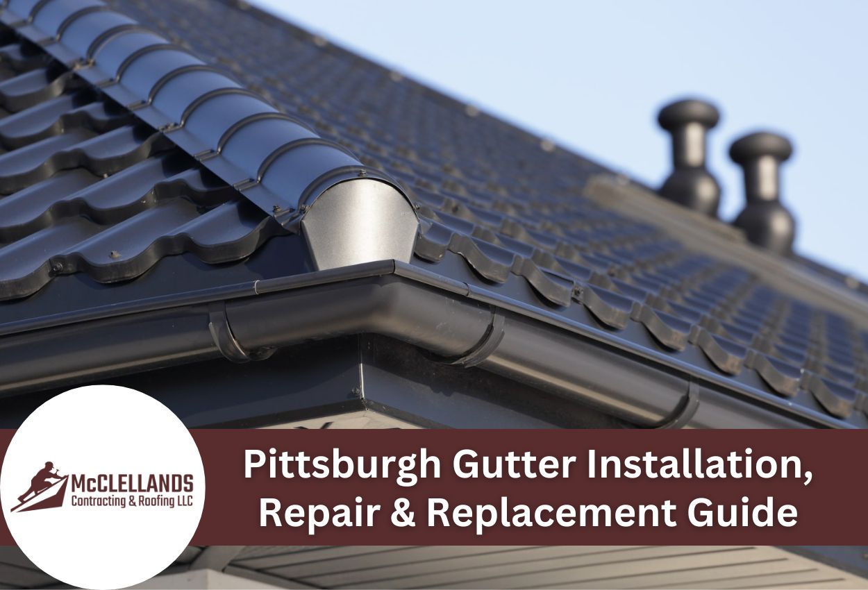 Close-up of modern black roof with gutters highlighting gutter installation.