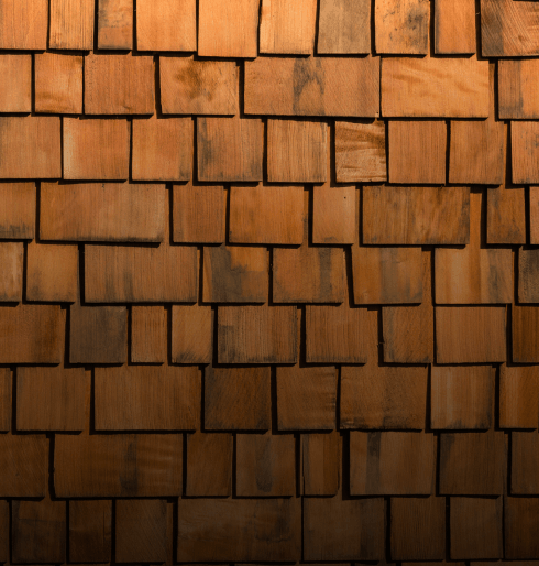 Wooden roof shingles with natural textures and patterns.
